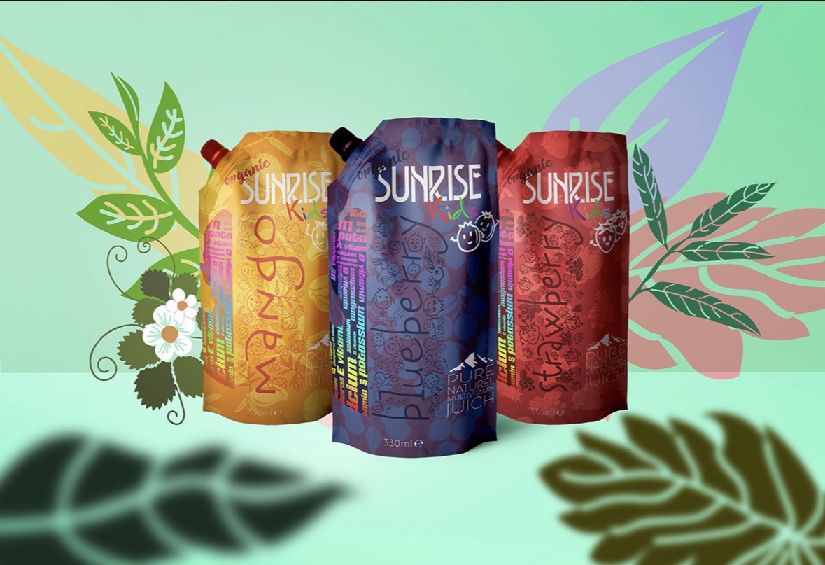 Three Sunrise Kids organic juice pouches in mango, blueberry and strawberry on a mint green background with illustrated leaves