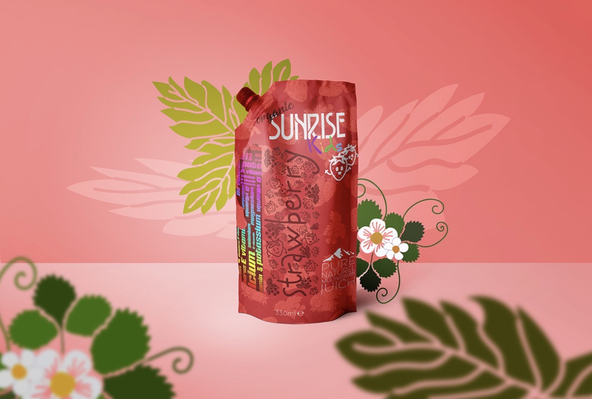 Red Sunrise Kids strawberry juice pouch on a coral pink background with illustrated flowers and leaves